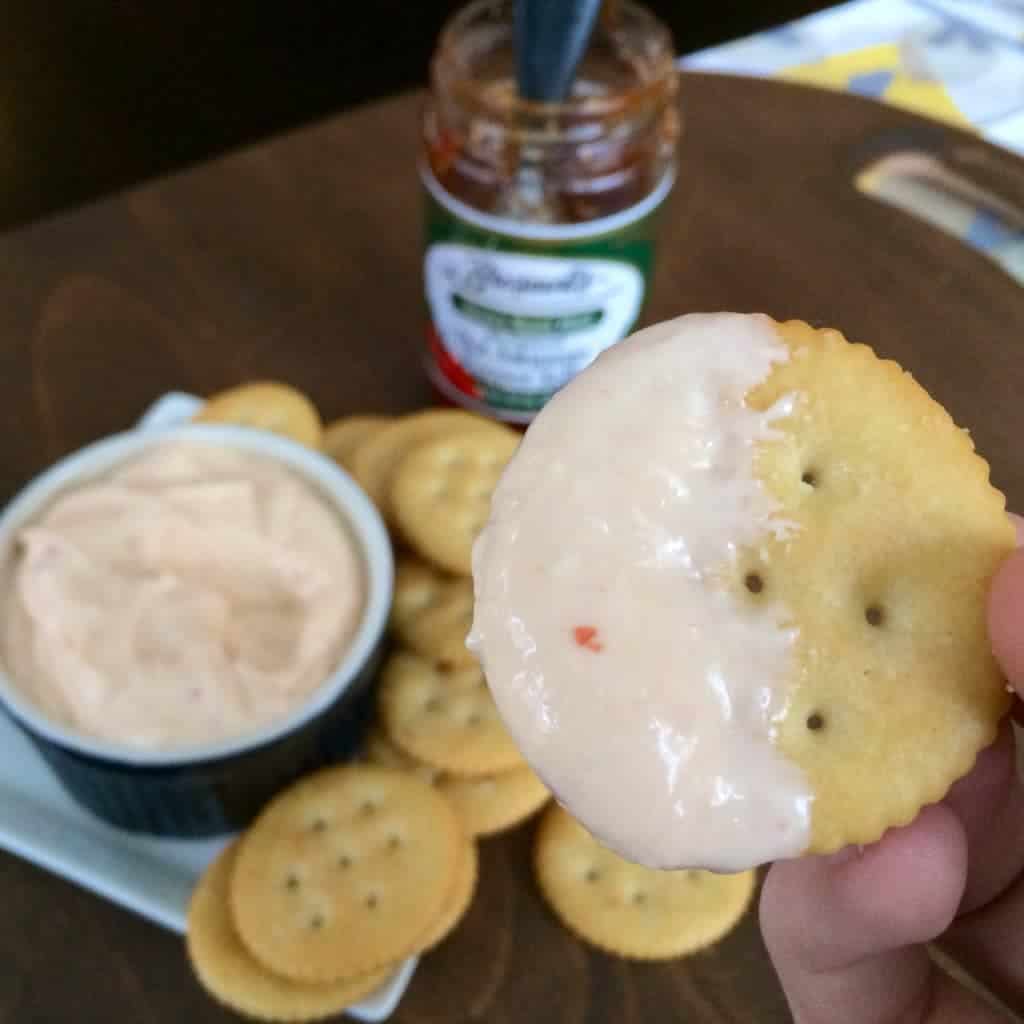 Image of a cracker with Pepper Jelly Dip.