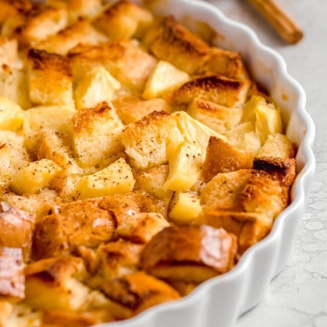 Pineapple Bread Pudding is a simple and delicious dish that is just perfect for Christmas. It works as both a side dish and a dessert, meaning you have plenty of reasons to eat it. The texture and flavor of this easy pineapple dessert is so good! It's fluffy, sweet, and the cinnamon on top is the perfect addition.