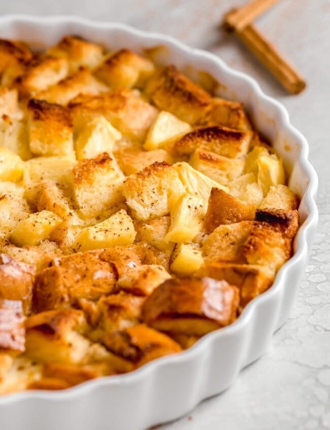 Pineapple Bread Pudding is a simple and delicious dish that is just perfect for Christmas. It works as both a side dish and a dessert, meaning you have plenty of reasons to eat it. The texture and flavor of this easy pineapple dessert is so good! It's fluffy, sweet, and the cinnamon on top is the perfect addition.