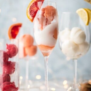 This is one of the BEST MIMOSA RECIPES for any brunch. It would even make a great dessert cocktail.  Sherbet Mimosas are a fun and creative way to dress up any mimosa recipe! Use the ice cream, sherbet, or sorbet flavor of your choice and mix with champagne. It's so fun, delicious, and beautiful! It's the perfect cocktail recipe to make for holidays, bridal showers, and beyond.