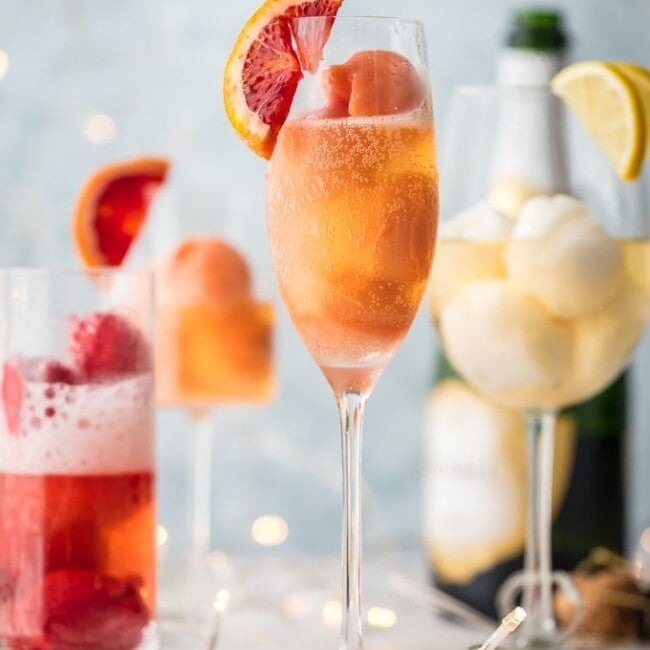 Sherbet Mimosas are a fun was to dress up any mimosa! Use the ice cream, sherbet, or sorbet flavor of your choice and mix with champagne. So fun, delicious, and beautiful! Perfect for holidays, bridal showers, and beyond.