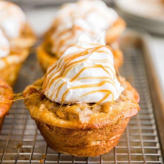 Apple Pie Cupcakes are one of the most delicious, EASY recipes on The Cookie Rookie. Apple Pie filling is stuffed into a pre-made cinnamon roll base to create the ultimate EASY Caramel Apple Cupcakes. This Cinnamon Roll Apple Pie Cupcakes Recipe has been a winner at our house, especially for Summer and Fall!