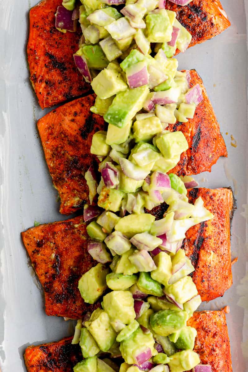 platter of grilled salmon with avocado salsa
