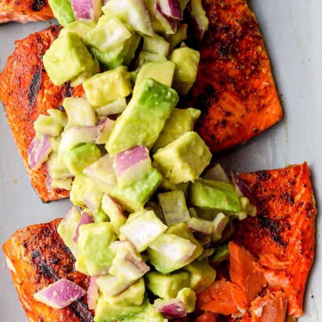 platter of grilled salmon with avocado salsa