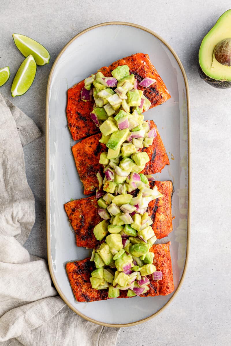platter of grilled salmon with avocado salsa