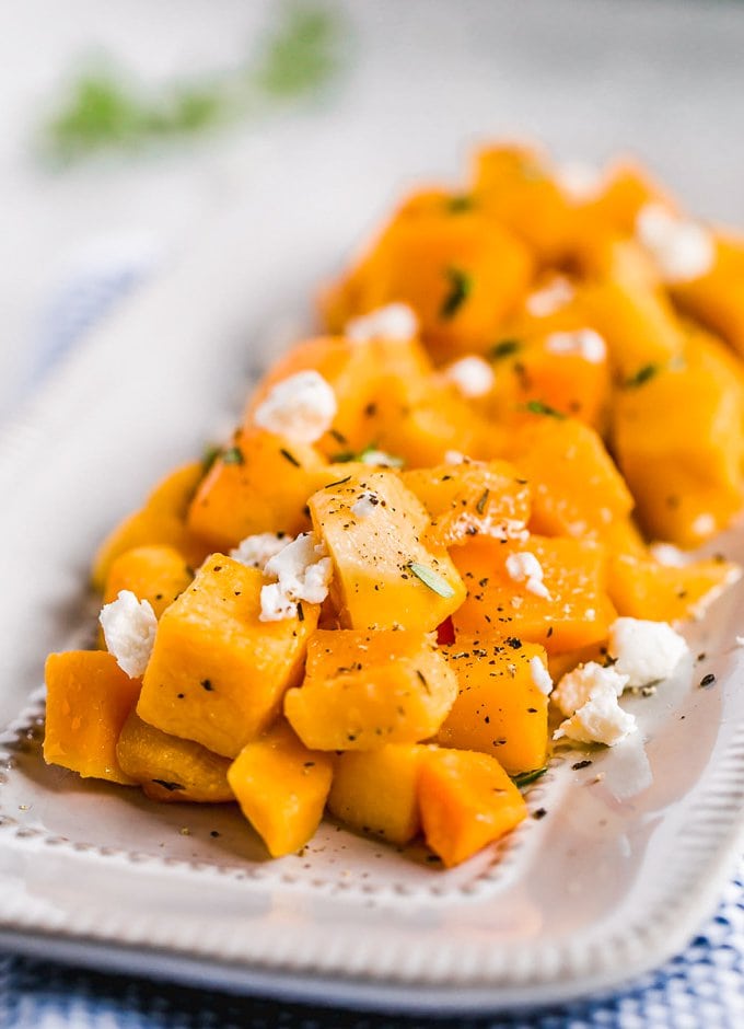 Baked Butternut Squash is such a simple side dish, but so delicious and healthy too. This maple-infused recipe is so sweet yet the broth balances it out perfectly. This maple roasted butternut squash recipe is easy to make, and you can also make a mashed version if you prefer. Pair it with your favorite main dish for dinner, or make this as the perfect Thanksgiving side dish! Winter Squash recipe with feta and maple
