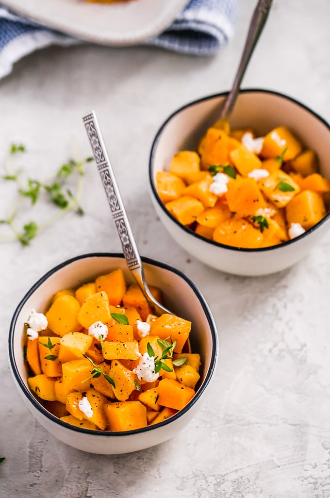 Baked Butternut Squash is such a simple side dish, but so delicious and healthy too. This maple-infused recipe is so sweet yet the broth balances it out perfectly. This maple roasted butternut squash recipe is easy to make, and you can also make a mashed version if you prefer. Pair it with your favorite main dish for dinner, or make this as the perfect Thanksgiving side dish! 2 bowls of maple baked butternut squash