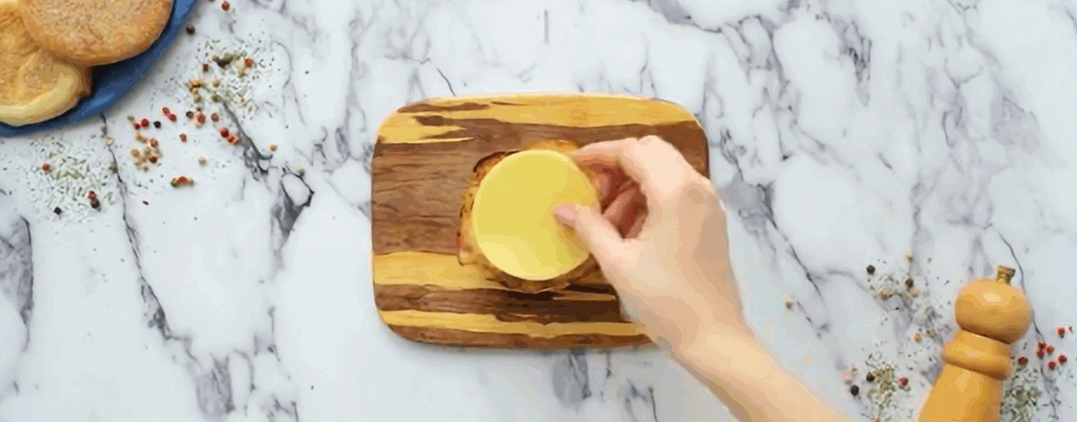 Layering the ingredients to make the Egg White Delight Sandwich. 