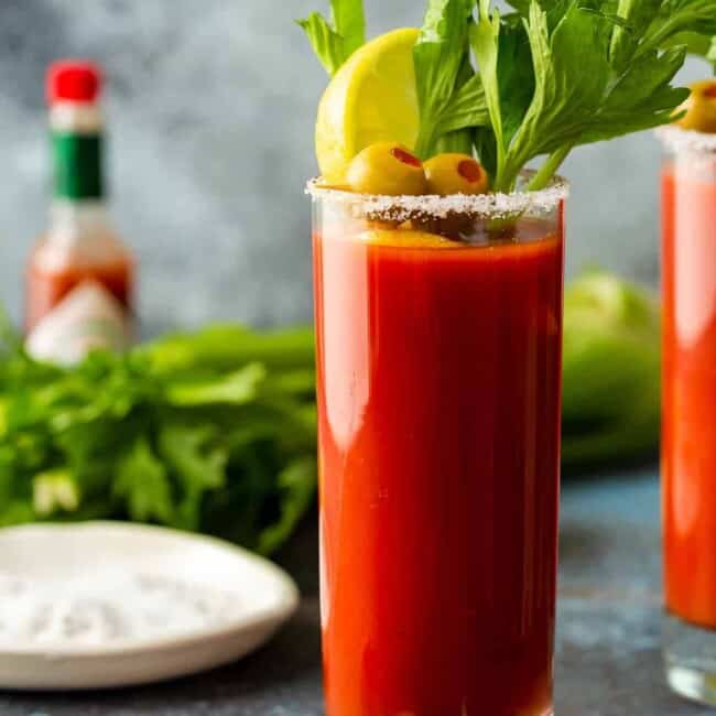 bloody mary in a tall glass with garnishes