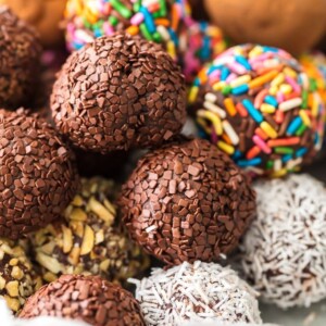 Chocolate Truffles are a must make recipe for any chocolate lover. This Easy Chocolate Truffle Recipe is made with only 5 ingredients and has a unique and amazing flavor. If you've wondered how to make chocolate truffles, this recipe is for you. Softer than fudge, bite-sized, and utterly perfect; this is a chocolate dessert recipe you simply can't miss.