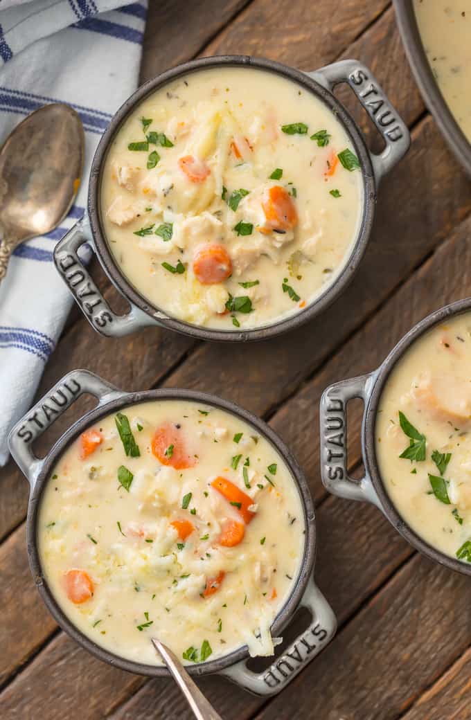 Creamy chicken soup topped with carrots and garnish