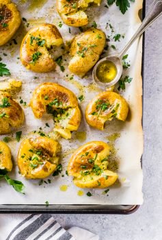 This Smashed Potatoes Recipe is a fun little side dish. They're nice and soft with just a little bit of crispy coating from the skin. I love using baby potatoes for these smash potatoes because they're the perfect size. Smashed Baby Potatoes are like a mix between fries and mini baked potatoes...or somewhere in between! They are just so tasty!