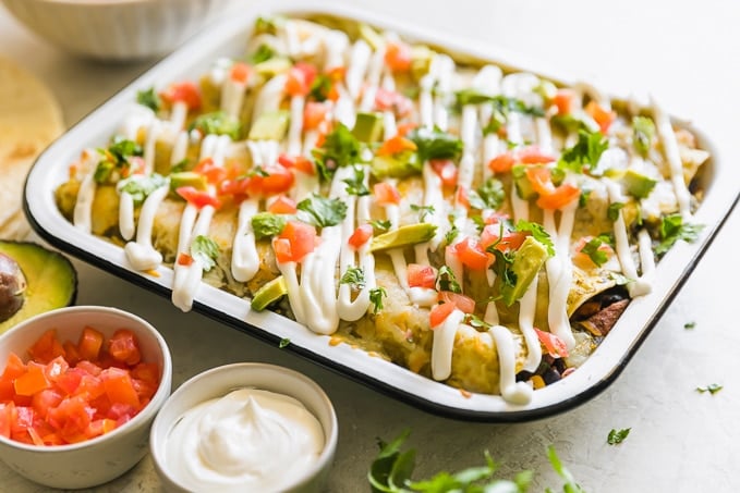 CHICKEN AND SWEET POTATO ENCHILADAS are a healthy and delicious way to enjoy Mexican night! We love these tasty sweet potato black bean enchiladas and make them on the regular. This Chicken and Sweet Potato recipe is filled with vegetables and all kinds of good stuff. They are definitely a new favorite!