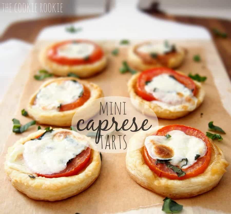 Mini caprese tarts on a baking sheet.