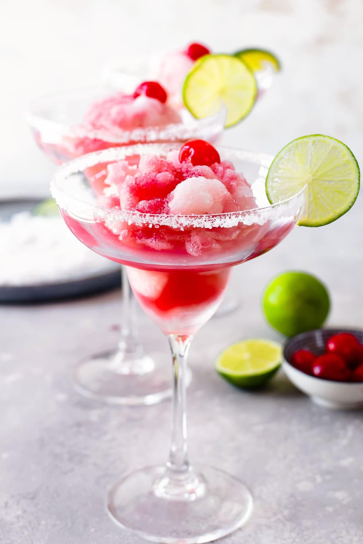 Margaritas with fruit in the background