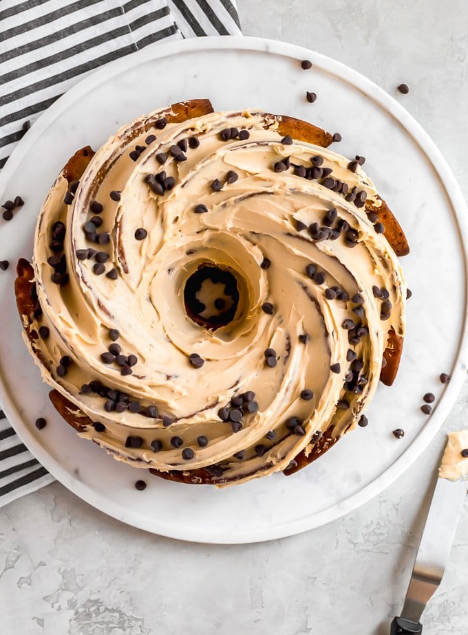 over the top shot of bundt cake now frosted 