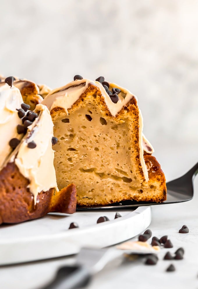 peanut butter banana bundt cake slice coming out of cake pan