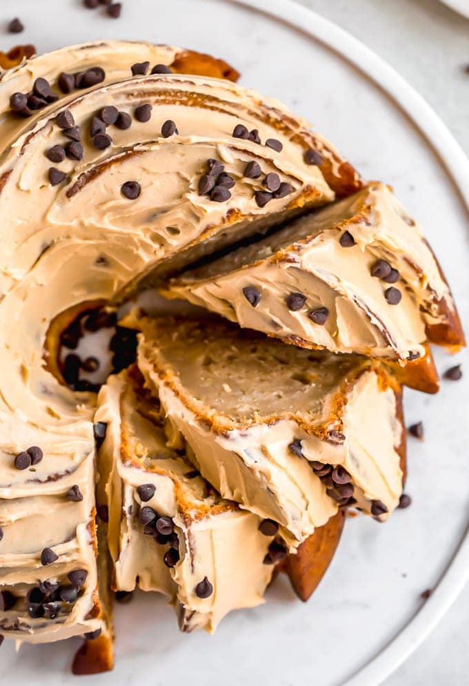 easy peanut butter banana bundt cake topped with frosting and chocolate chips