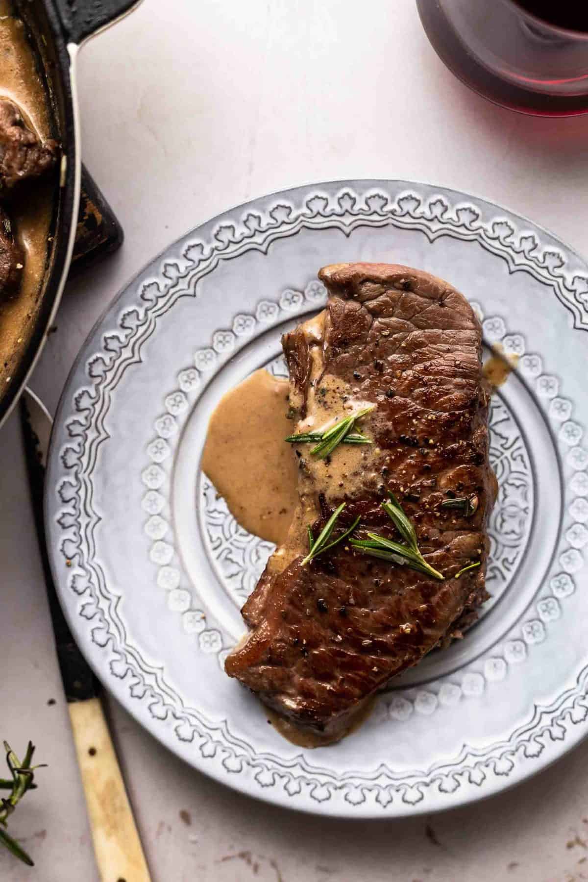 Garlic Rosemary Steak With Sherry Cream Sauce on a plate