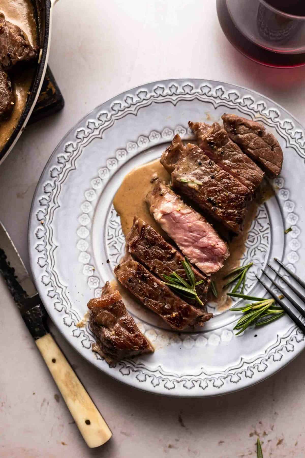 Garlic Rosemary steak sliced on a plate