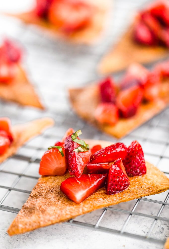 Homemade cinnamon tortilla chips topped with strawberry basil salsa