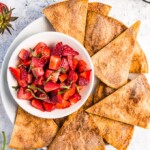 Strawberry Salsa with Cinnamon Tortilla Chips is a fresh & simple summer appetizer. This easy fruit salsa recipe pairs perfectly with homemade cinnamon sugar tortilla chips!
