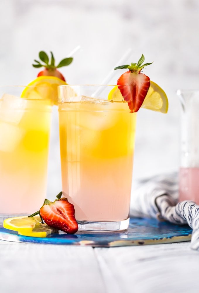 summer shandy topped with strawberries and lemon