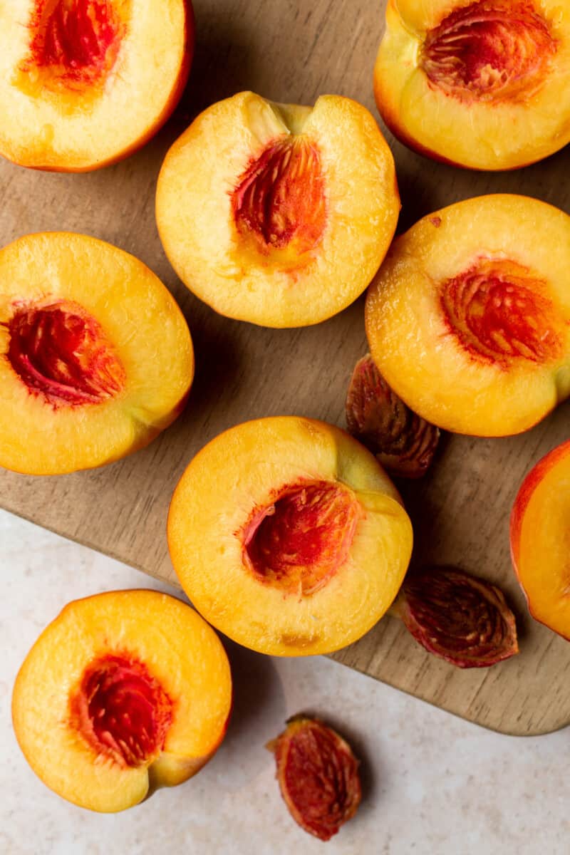 sliced peaches on table