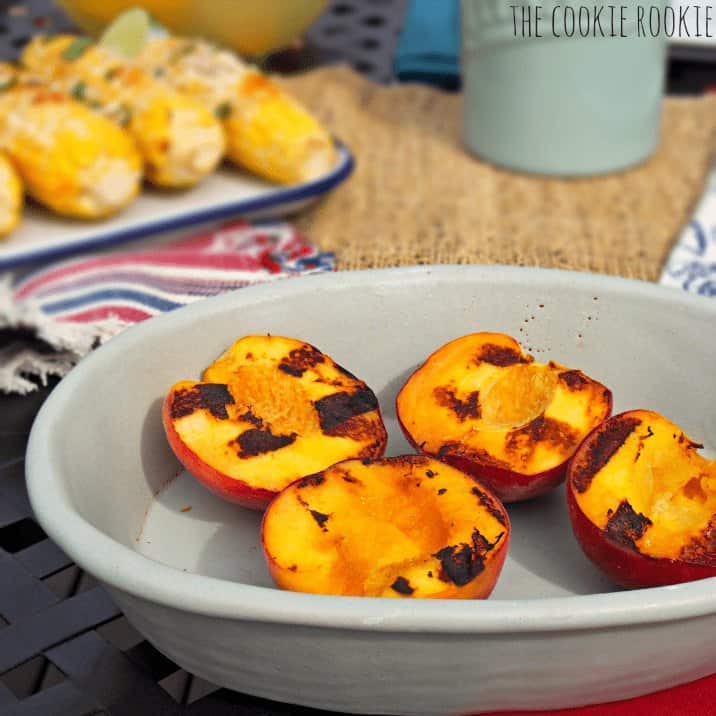 Grilled peaches in a bowl.