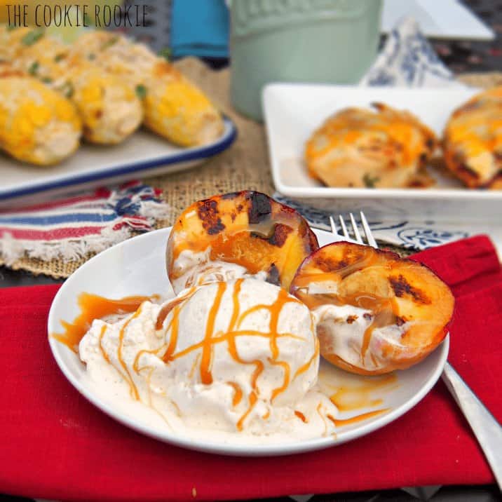 Side shot of ice cream, caramel sauce, and grilled peaches.