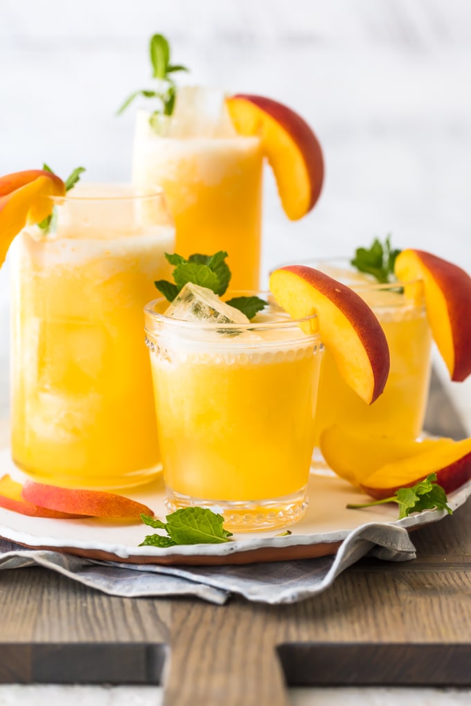 peach lemonade in glasses on a plate