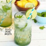 two glasses of mint mojito with limes and lemons.
