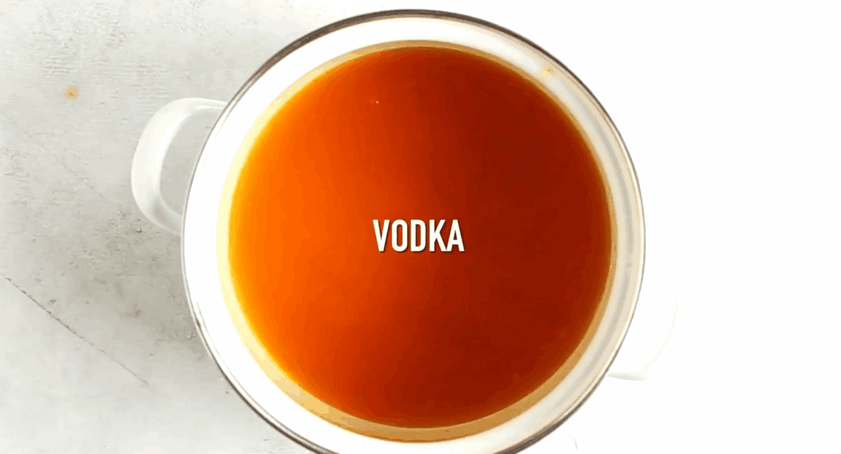 Adding vodka to the pumpkin pie filling. 