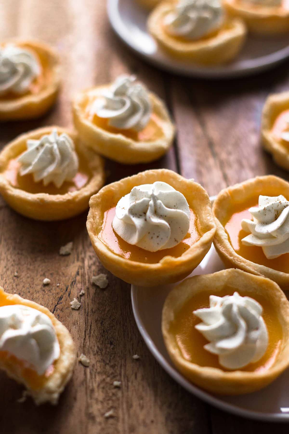 Pumpkin Pie Jello Shots arranged on small white plates