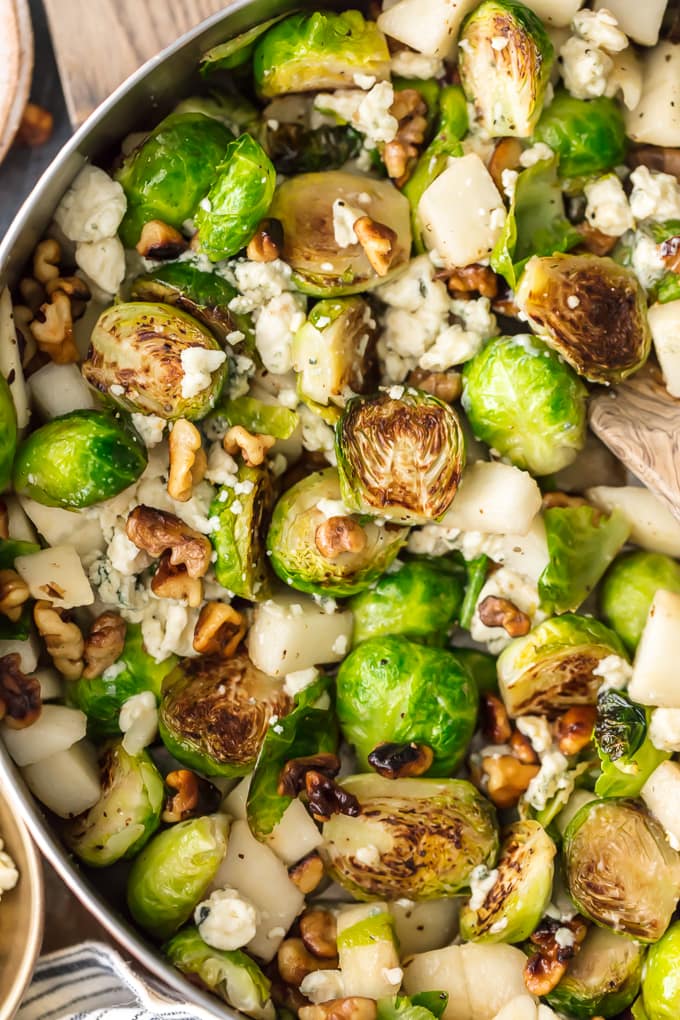  This Brussels Sprouts Recipe with Pears, Blue Cheese, and Walnuts Pear and Blue Cheese Roasted Brussels Sprouts is our favorite way to dress up a healthy side dish. These Brussels Sprouts are unique and so full of flavor. The pear pairs (ha!) beautifully with the blue cheese and toasted walnuts, making sure even the pickiest eater want to eat their greens. Such a great holiday side dish!