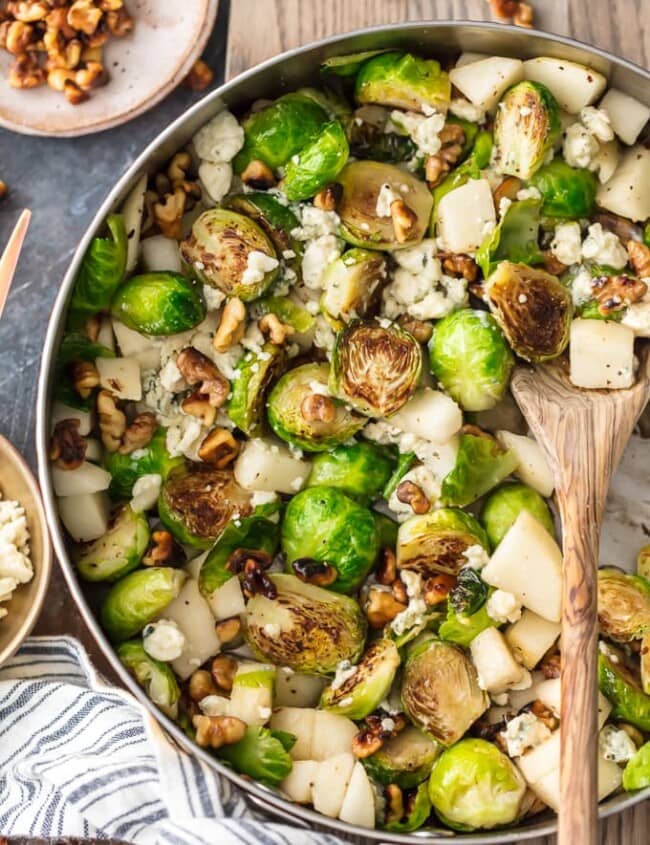  This Brussels Sprouts Recipe with Pears, Blue Cheese, and Walnuts Pear and Blue Cheese Roasted Brussels Sprouts is our favorite way to dress up a healthy side dish. These Brussels Sprouts are unique and so full of flavor. The pear pairs (ha!) beautifully with the blue cheese and toasted walnuts, making sure even the pickiest eater want to eat their greens. Such a great holiday side dish!
