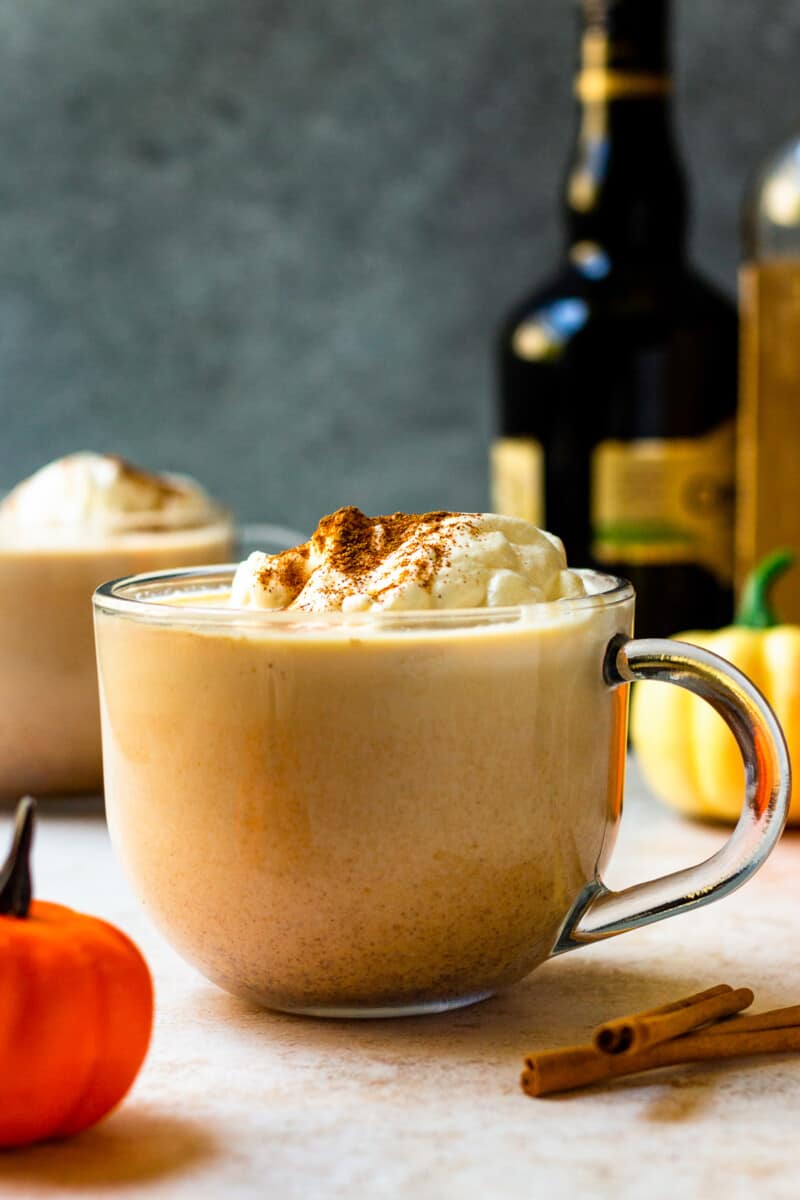 hot pumpkin cocktail in mug with whipped cream