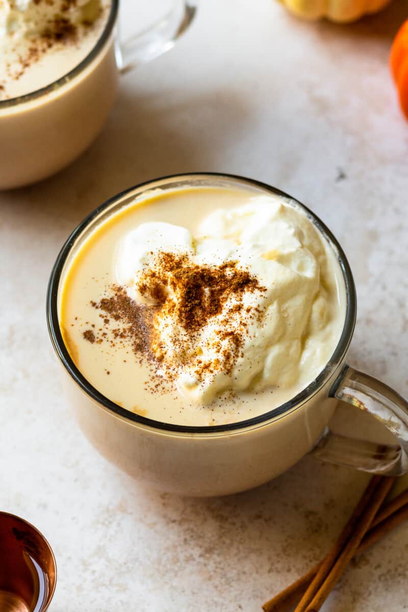 overhead hot pumpkin cocktail in mug with whipped cream