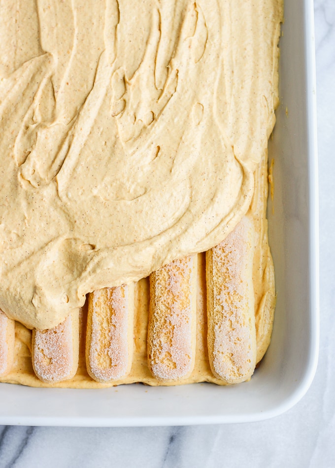 Pumpkin Dessert Lasagna: Baking dish filled with pumpkin mousse and lady fingers
