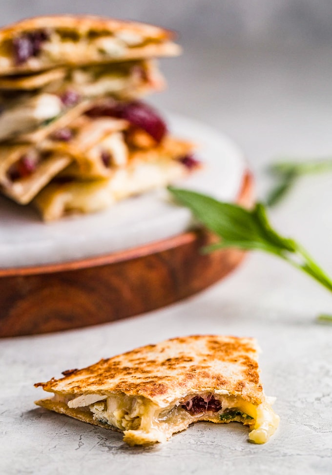 Thanksgiving quesadilla filled with turkey, cheese, sage, and cranberry sauce.
