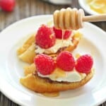 Raspberry and Honey Goat Cheese Bruschetta! A simple and elegant dessert appetizer. SO yum! | The Cookie Rookie