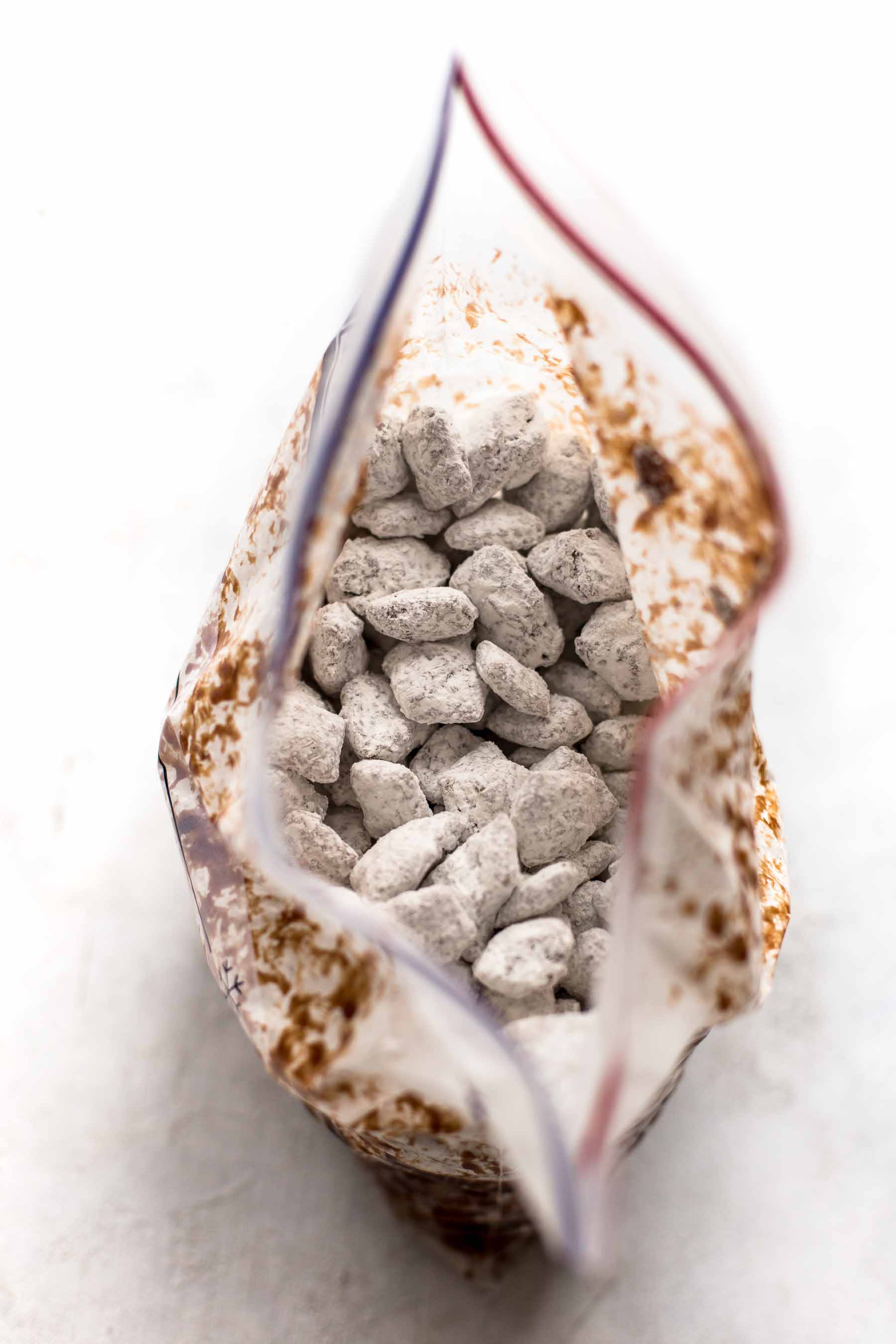 powdered sugar coated chex cereal (puppy chow) in a ziploc bag