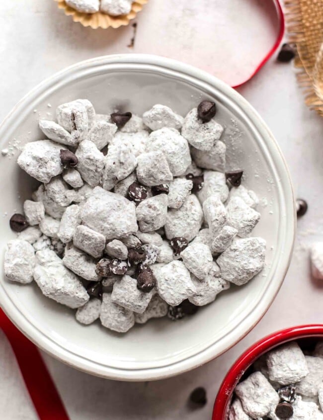 Salted Caramel Puppy Chow is so addicting! If you're a fan of puppy chow snack mix, you're going to love this flavor combo. Chex cereal topped with caramel, chocolate, and powdered sugar. YUM!