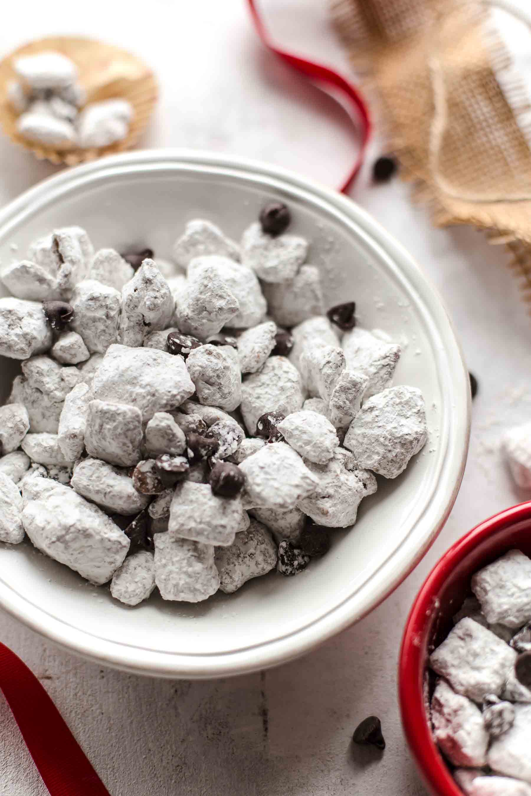 white bowl filled with salted caramel puppy chow mix