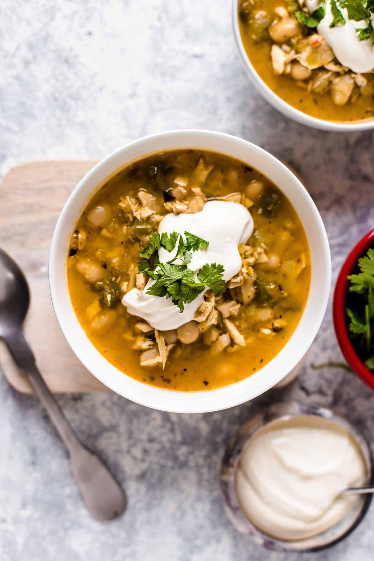 spicy chicken and white bean chili topped with sour cream