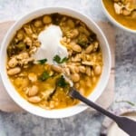 White Bean Chicken Chili is a super easy and deliciously spicy recipe. This EASY chicken chili recipe is perfect for those colder months, and it's so full of flavor. This spicy chili recipe is sure to warm you right up! You definitely need to make up a batch of this easy white chicken chili ASAP!