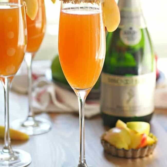 This Apple Cider Mimosa Recipe is simple, delicious and the perfect for Fall! You deserve such a fun and bubbly treat once in a while. Thanksgiving is the perfect time for an Apple Cider Cocktail, especially one as easy and tasty as this. If you've wondered how to make the perfect mimosa, this recipe is for you! I love a Mimosa, and this is my favorite Mimosa Recipe!