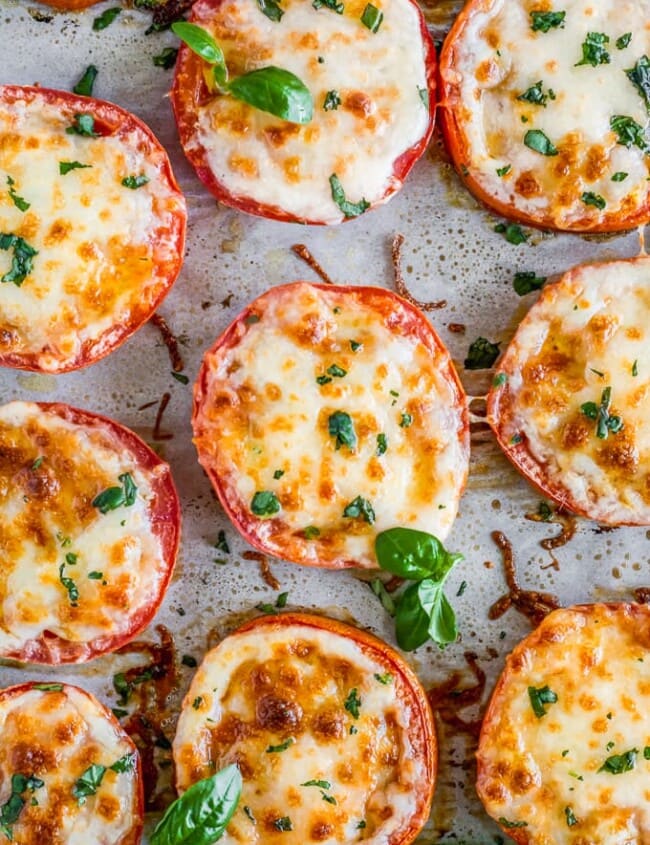 BAKED TOMATOES are a super quick and super easy side dish or appetizer for any occasion! These cheesy Baked Tomatoes with Mozzarella and Parmesan cheese are so simple yet incredibly delicious. They are always a hit when we make them and get eaten right away. These Baked Parmesan Tomatoes are just too tasty and fresh. 