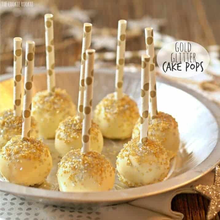 several lemon cake pops with gold glitter sprinkles on a plate