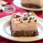 a slice of peppermint ice cream brownie bar on a white plate